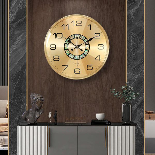 Brass wall clock with abalone shell inlay and gold finish