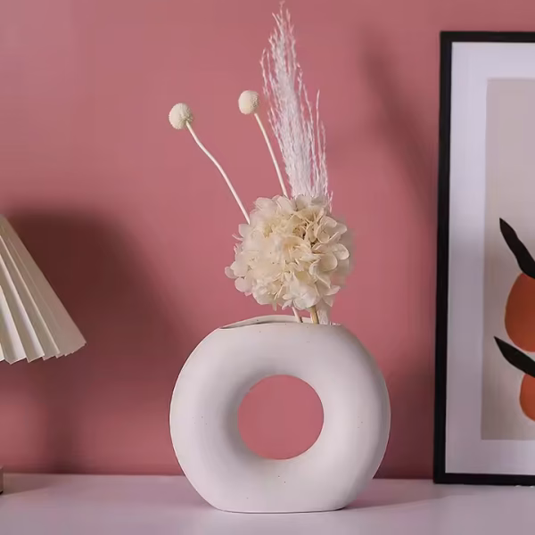 Donut-shaped ceramic flower vase in beige matte finish
