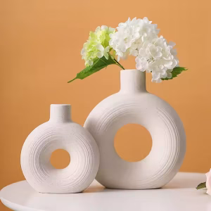 Minimalist hollow ceramic flower vase with donut design in beige
